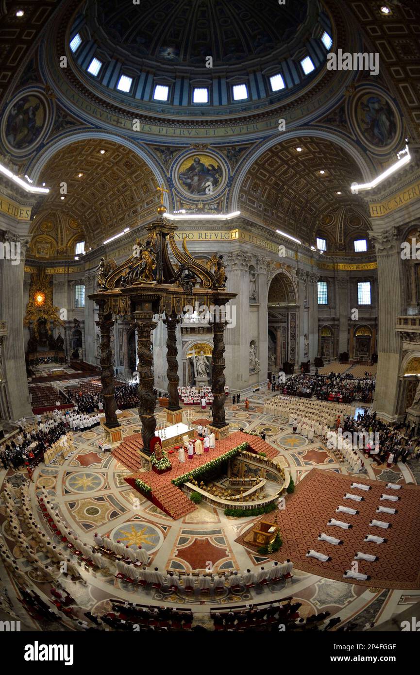 Thirteen new priests lay on the ground during a ceremony in which Pope Francis ordained them, in