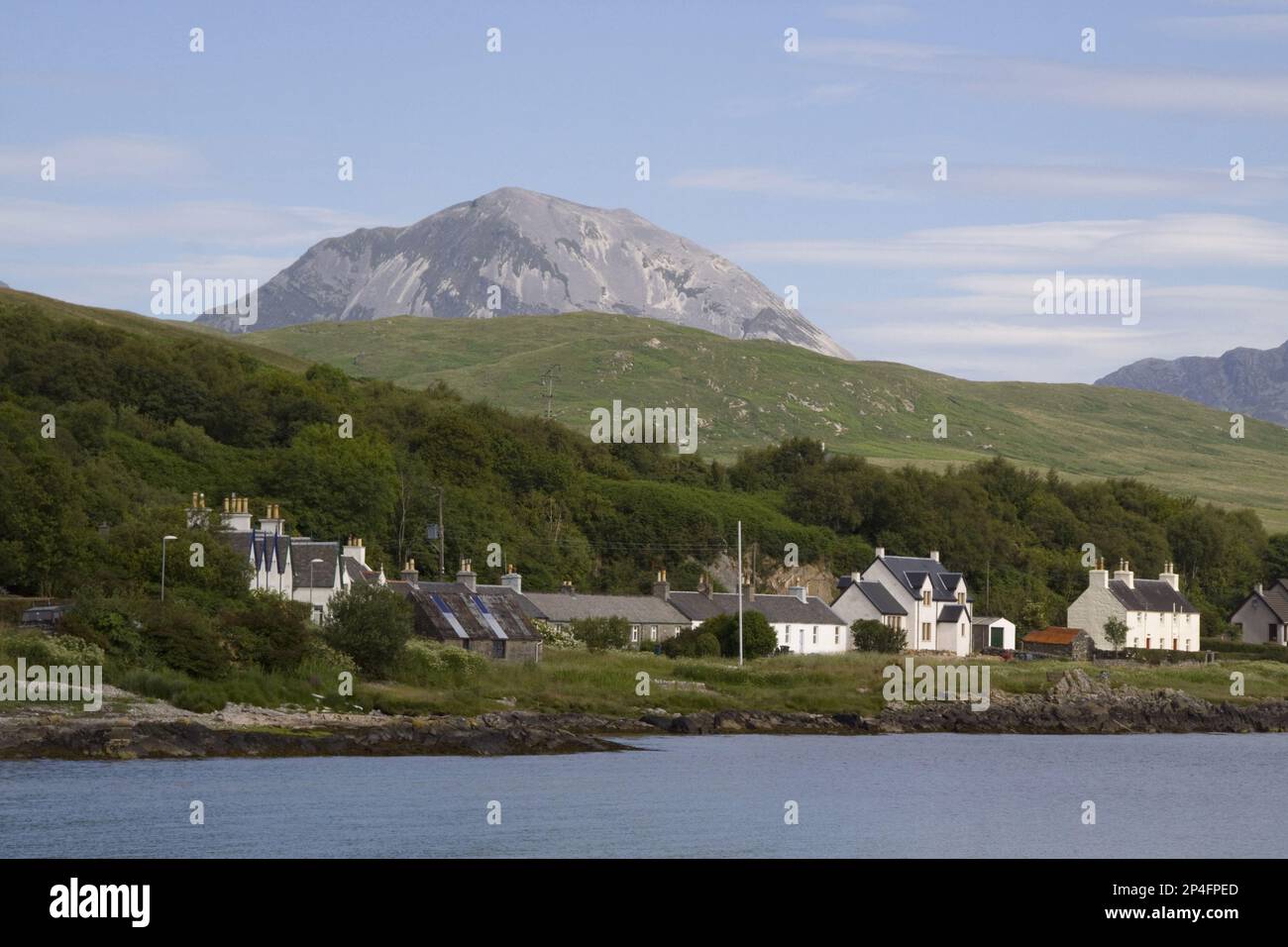 Seen from Craighouse, the three distinctive and easily recognisable Paps of Jura dominate the view from almost every direction Stock Photo