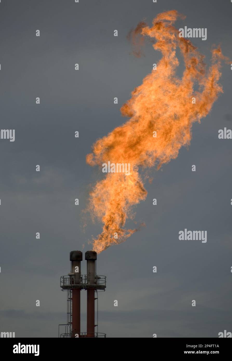 Gas flare from chimney, Tangguh LNG (Liquified Natural Gas) plant, Bintuni Bay, West Papua (Irian Jaya), Indonesia Stock Photo