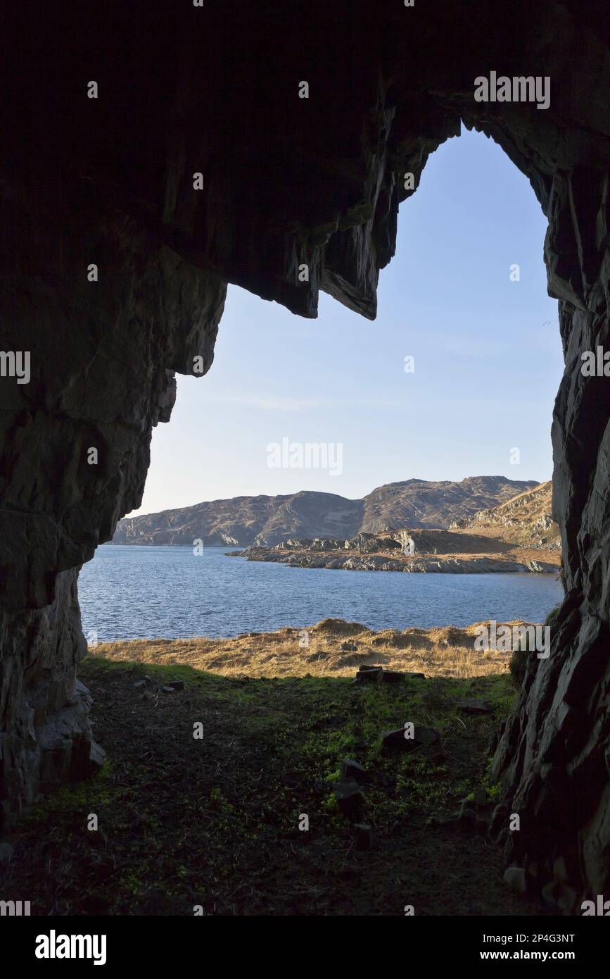 View of northwest coastline from cave, looking towards Scarba and Gulf of Corryvreckan, Isle of Jura, Inner Hebrides, Scotland, United Kingdom Stock Photo