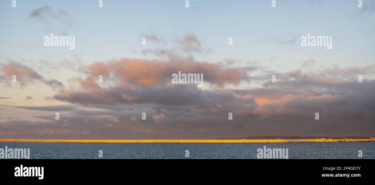 Seascape during dramatic stormy sunset-panorama Stock Photo