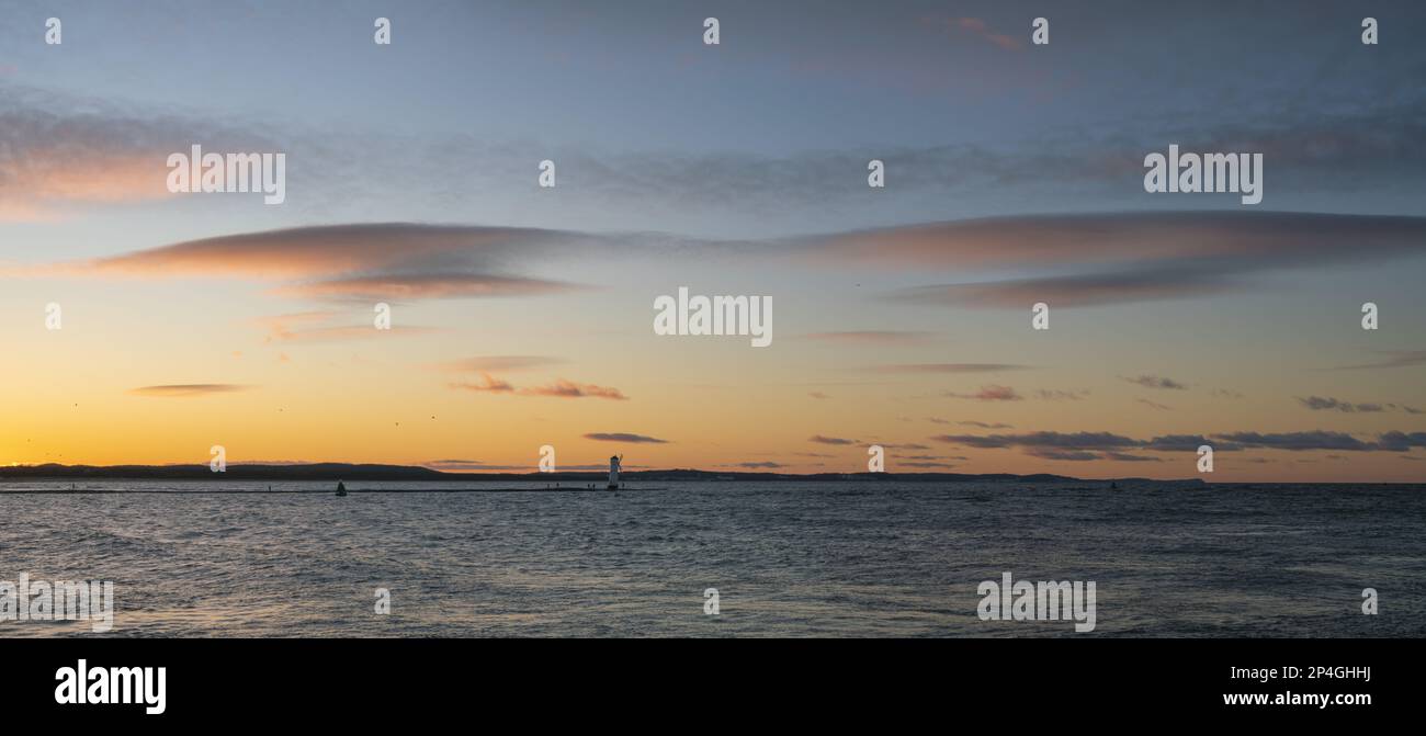 Seascape during dramatic stormy sunset-panorama Stock Photo