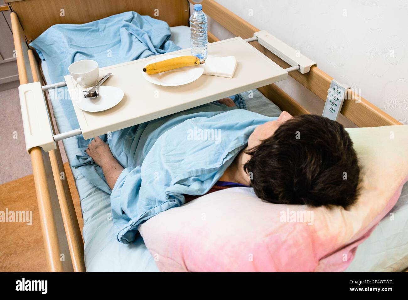 Sick Woman And Table With Dishes And Banana On Homecare Electric ...