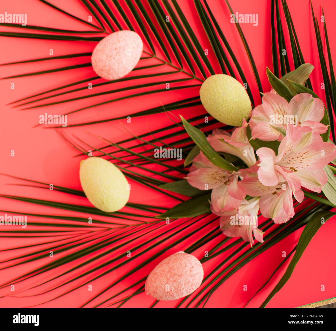 Easter arrangement with pink lilly flowers, pastel easter eggs and