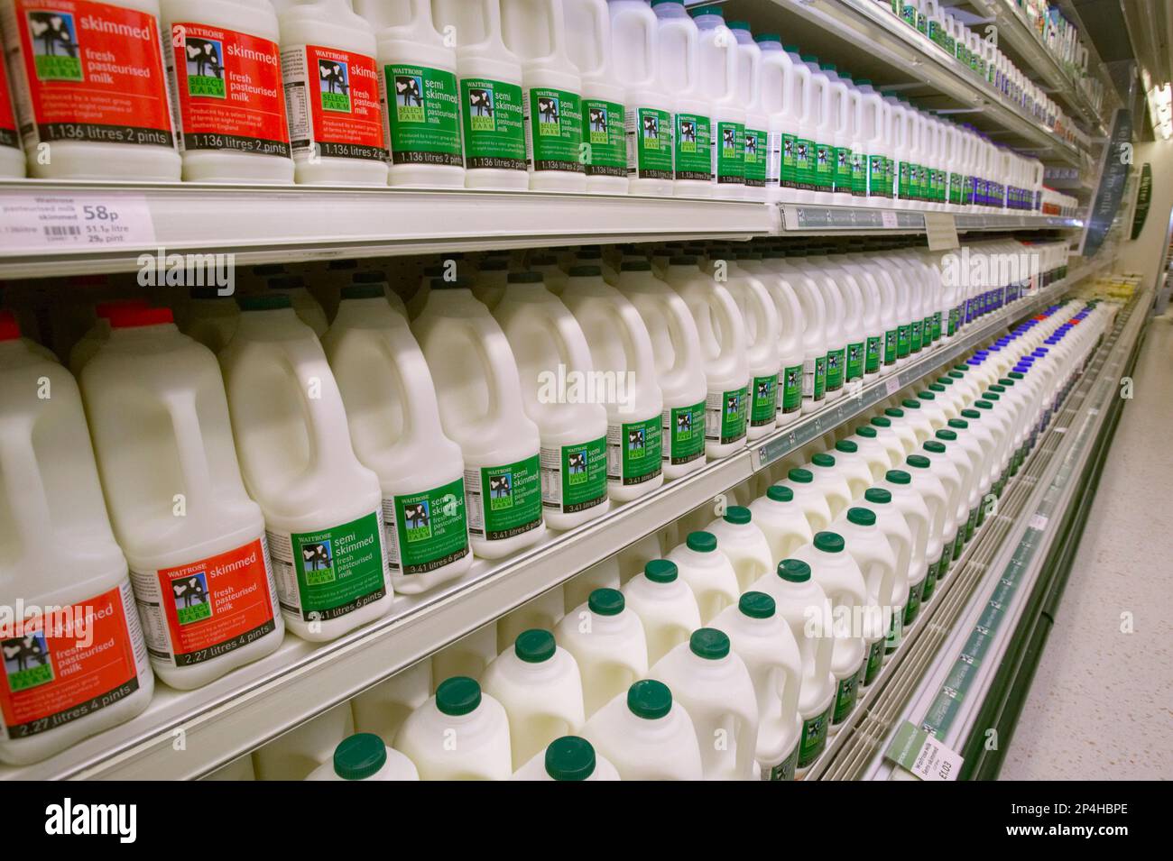 Packaged milk on supermarket shelves. Full shelves. Waitrose Stock