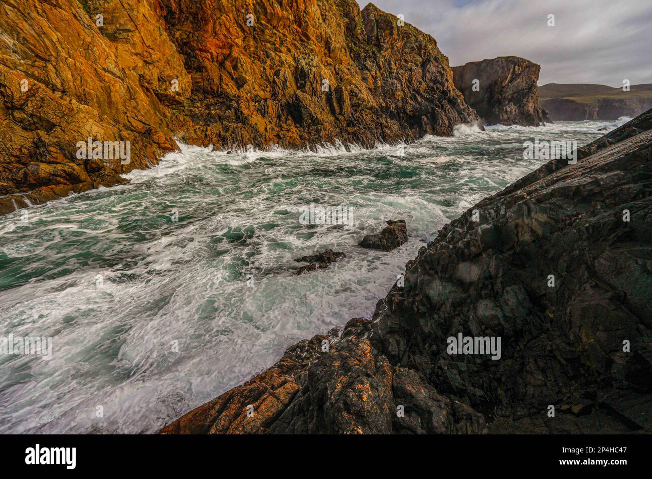 Waves crash on Arranmore Cliffs Stock Photo