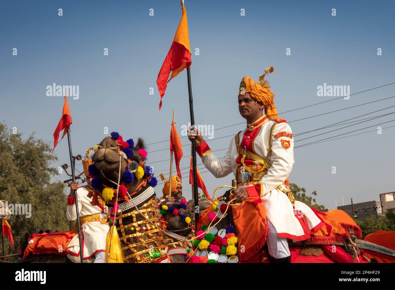 India, Rajasthan, Bikaner, Camel Festival Parade, camel-mounted Border Security Force soldiers in dress uniform Stock Photo