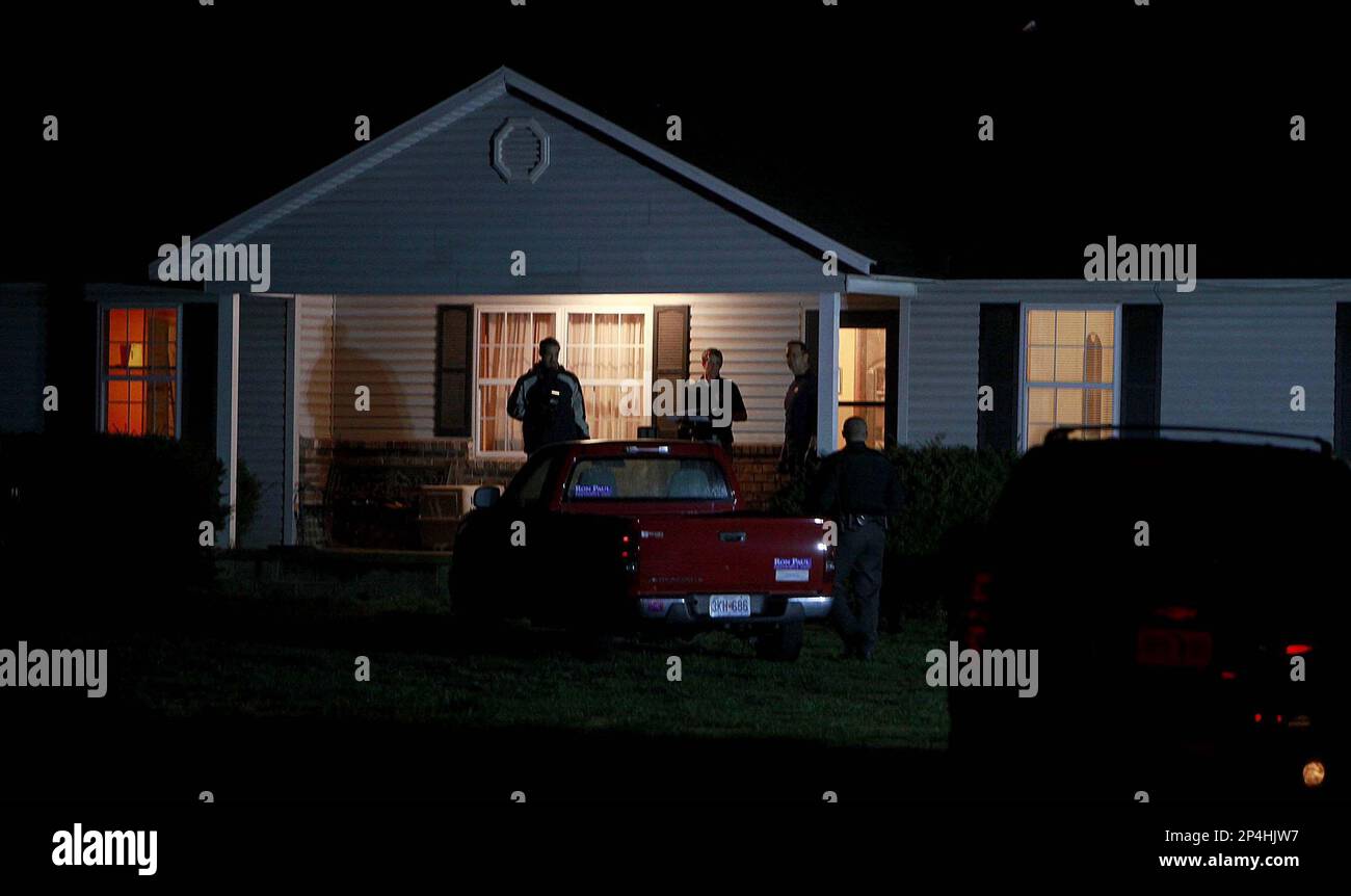 Members of the ATF and FBI search a house belonging to Fraiser Glenn