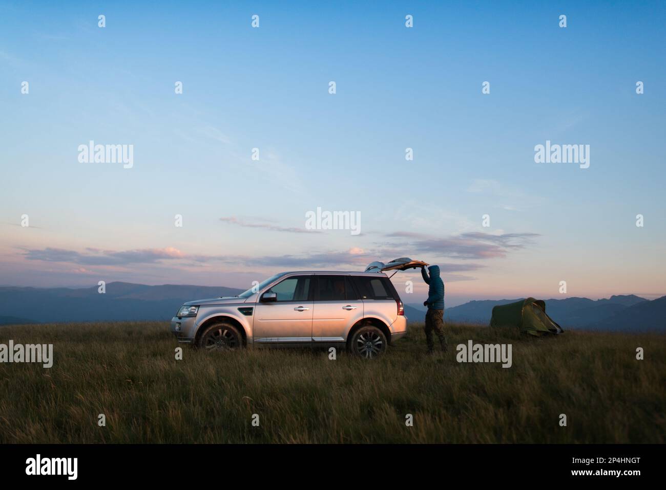 Summer Camper in the Mountains Stock Photo - Alamy
