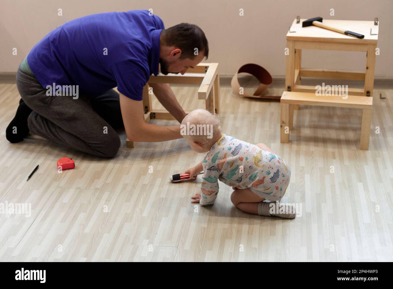 Father making wooden help station for his son with his help Stock Photo