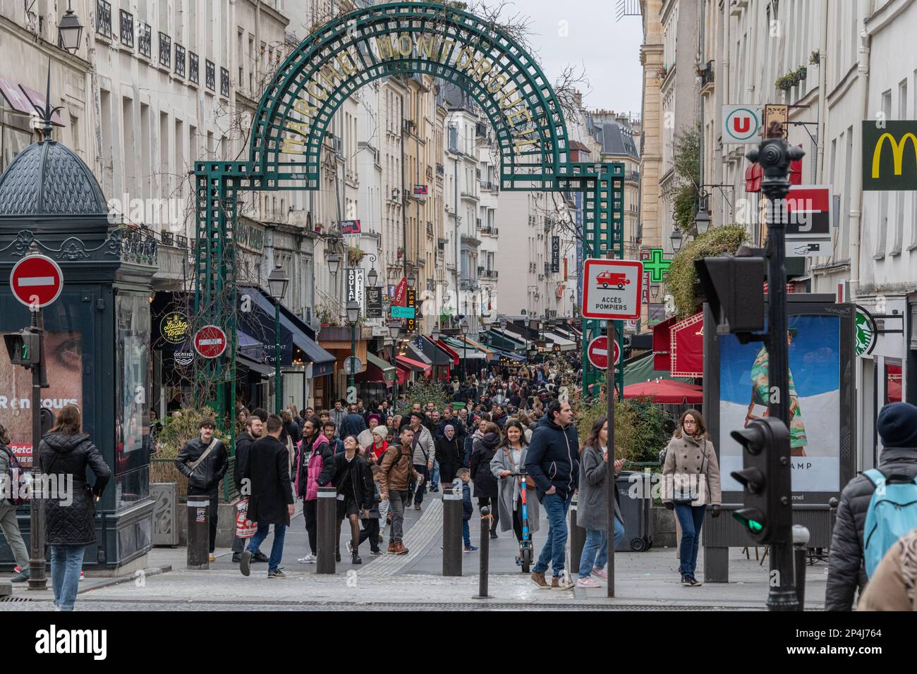 Crowds of people on the Rue des Petits Carreaux in Montorgueil 2nd Arrondissement Paris. Stock Photo