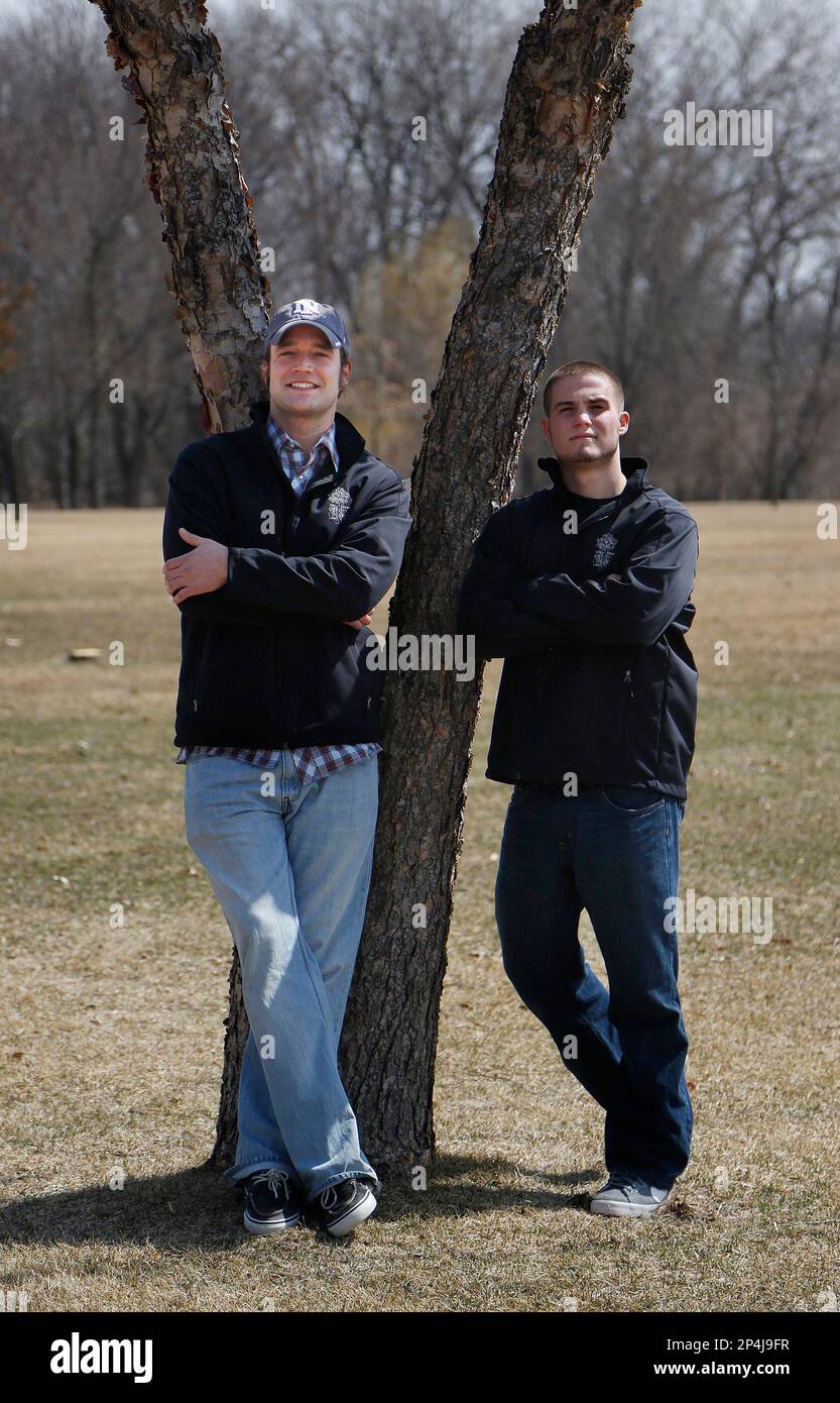 In this Monday, March 31, 2014 photo, Josh Koppes, left, president, and  Seth Trautmann, right, vice president of UNI Hardwoods, a 2-year-old  student organization, pose for a photo in Gateway Park, in