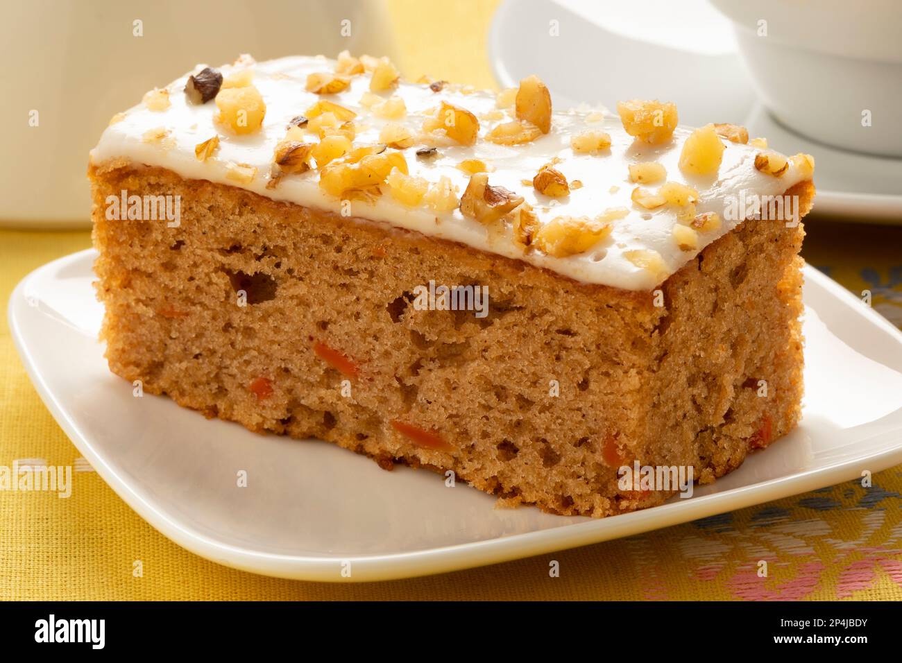 Piece of homemade carrot cake on a plate close up Stock Photo