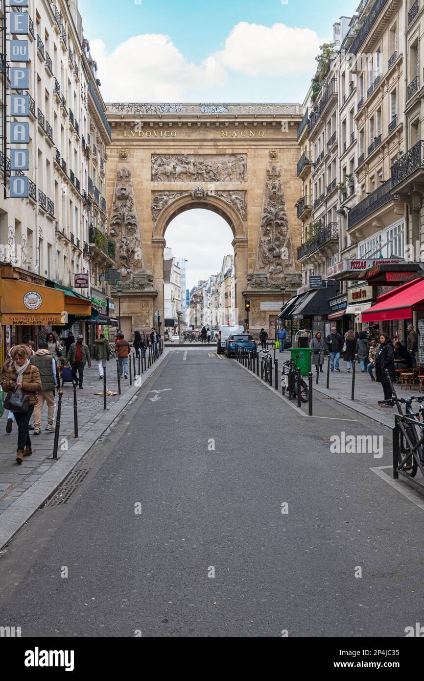 Porte Saint Denis seen from Rue du Faubourg in the 10th Arrondissement in Paris. Stock Photo