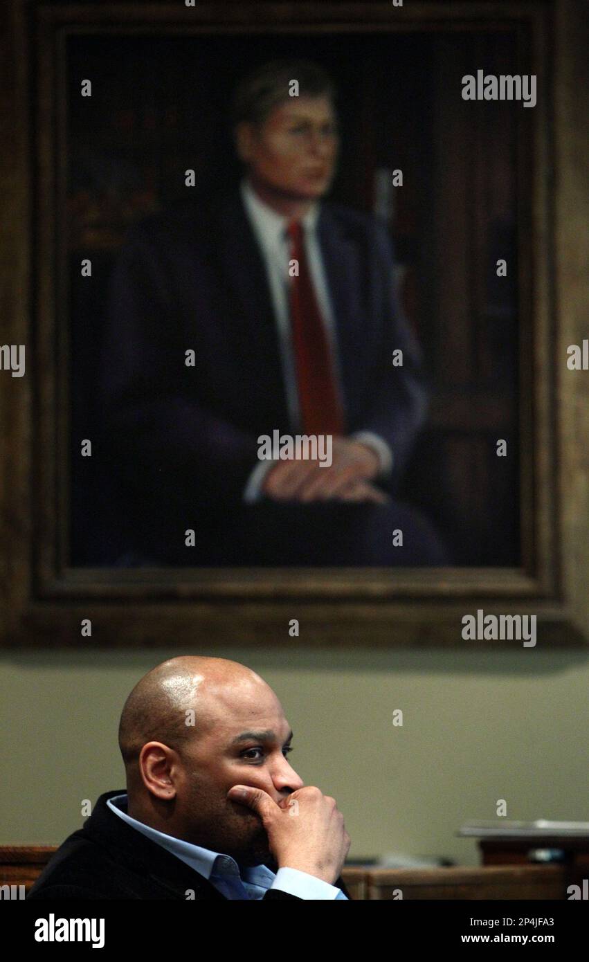 In this April 1, 2014 photograph, defendant Calvin Rogers listens to ...
