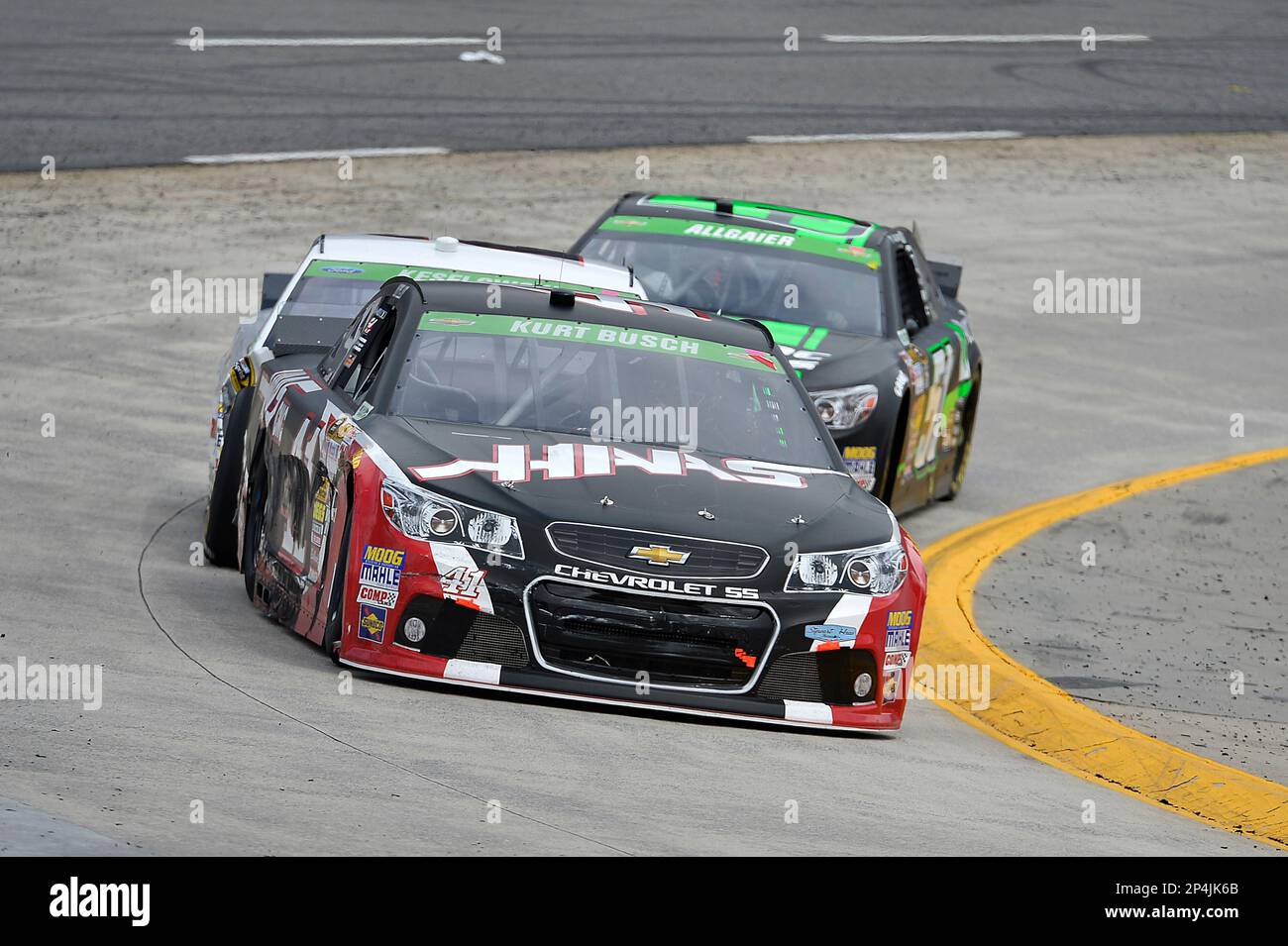 Kurt Busch leads Brad Keselowski and Justin Allgaier during the NASCAR
