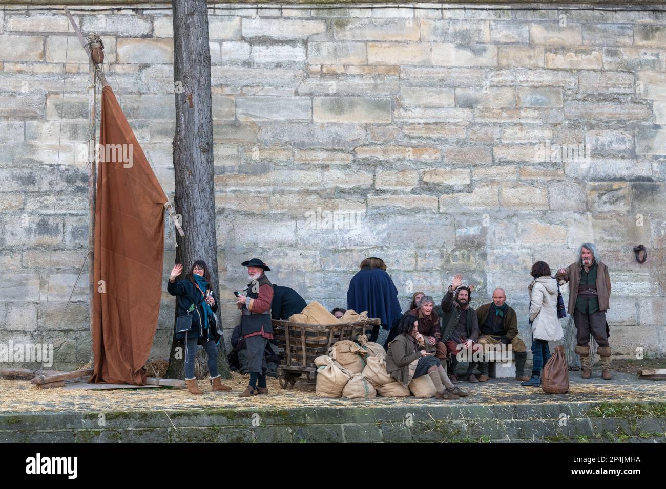 Actors in Medieval costume on an open air set next to The River Seine, Paris. Stock Photo