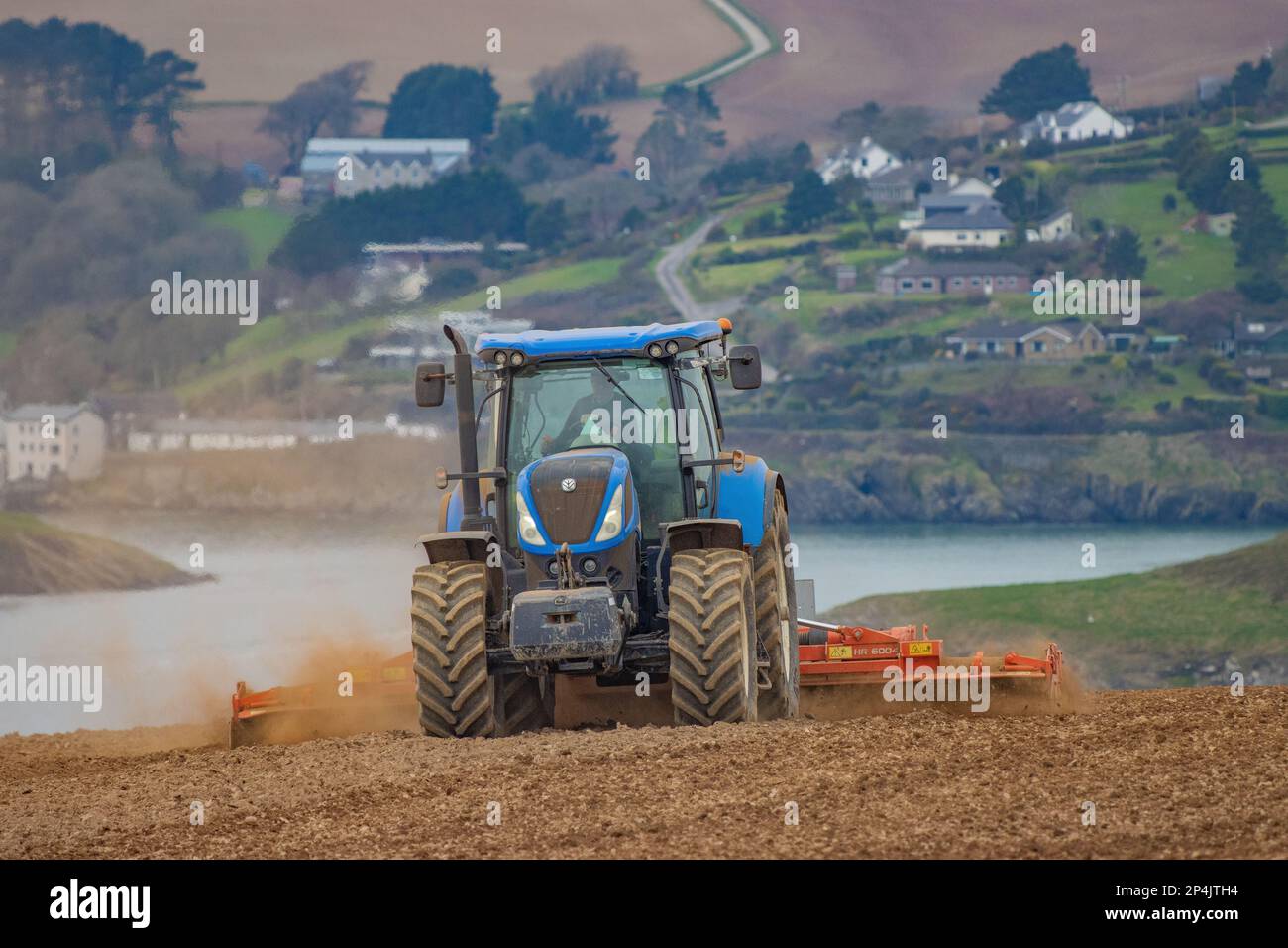 Martin O'Regan sowing spring oats near Kinsale, Co. Cork, March '23 Stock Photo