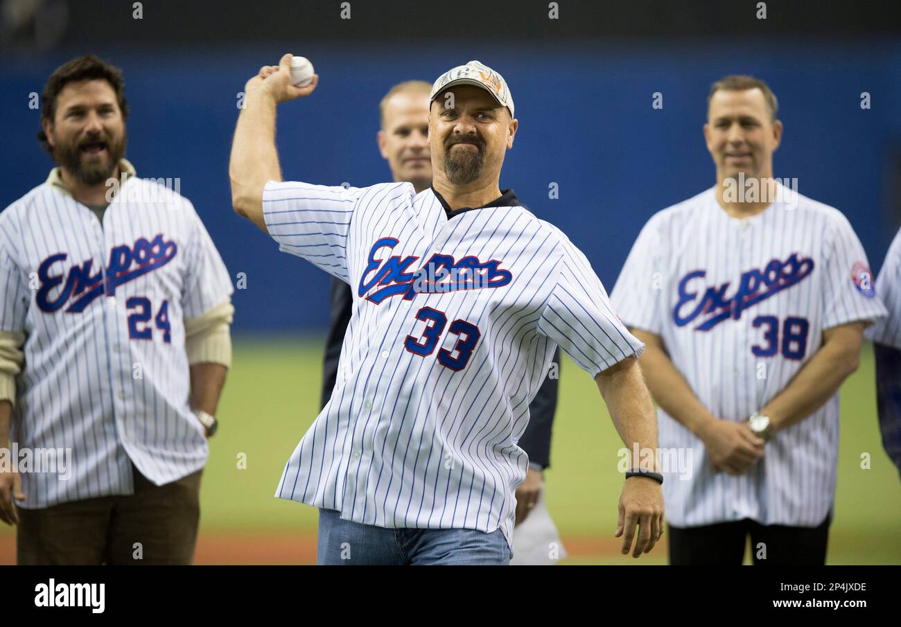 Former Montreal Expos Larry Walker throw the opening pitch as