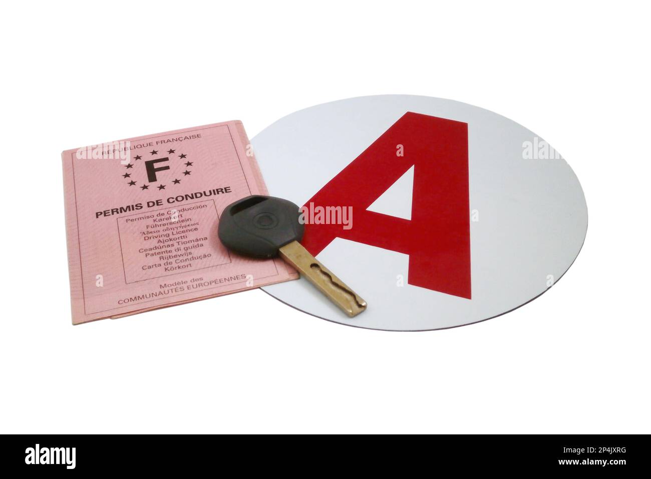 Studio shot of a set of French driver's license, with a car key and a magnetic A disk. Stock Photo