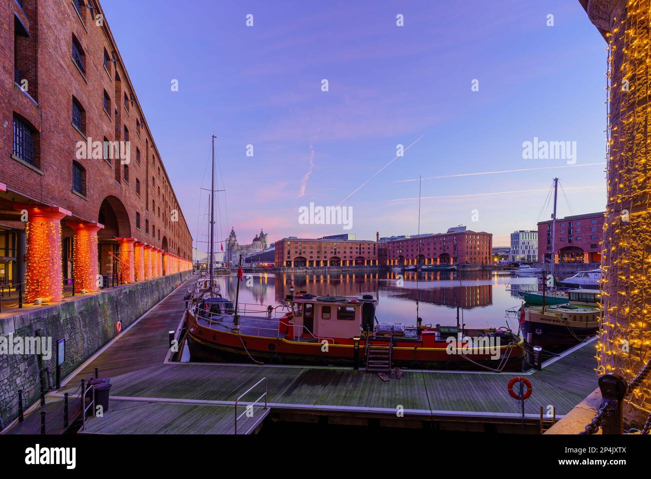 Liverpool, UK - October 09, 2022: Sunrise view of the Royal Albert Dock, with various buildings, in Liverpool, Merseyside, England, UK Stock Photo