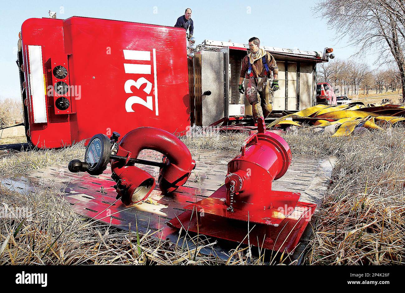The parts of a deluge gun lie on the ground as Fosterburg, Ill