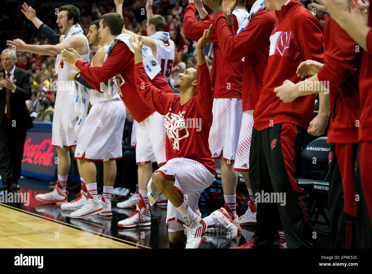 Wisconsin Badgers teammates celebrate during the thirdround game in