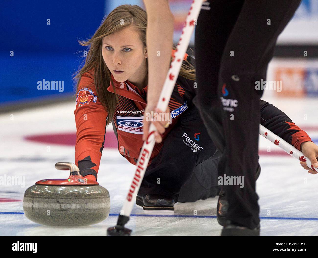 Canada skip Rachel Homan releases a rock against Switzerland in the