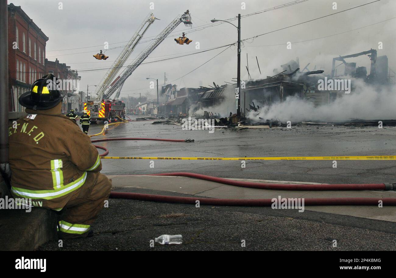 Garrettsville firefighter Ted Stryczny takes a break and watches as several area fire