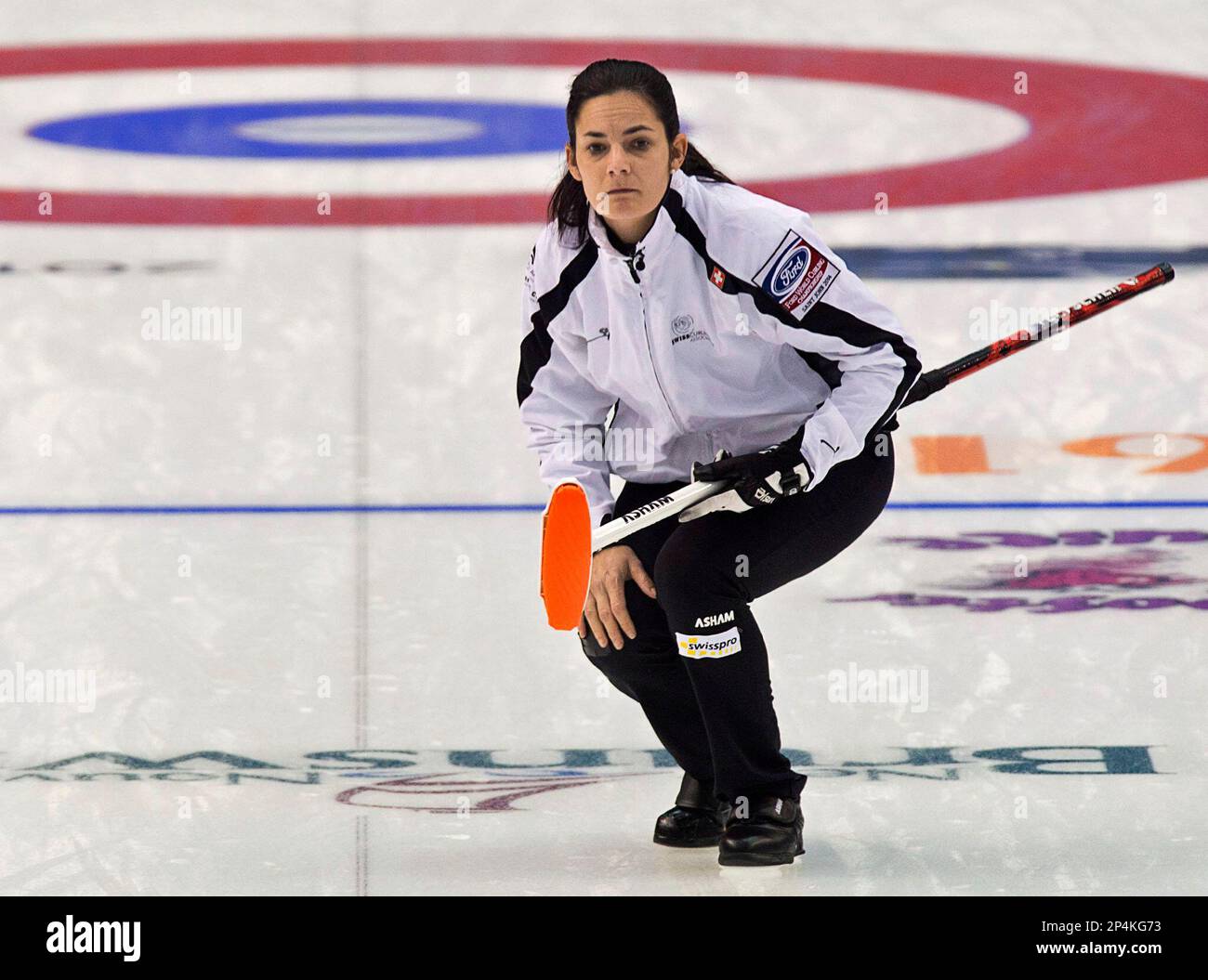 Switzerland skip Binia Feltscher watches a rock during a match against ...