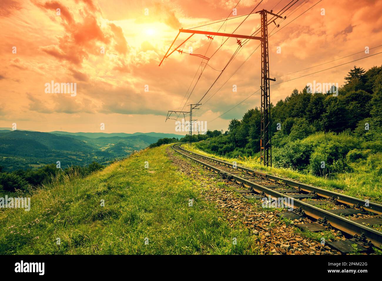 View of the railway in the mountains in autumn. Beautiful cloudy sky over the mountains Stock Photo