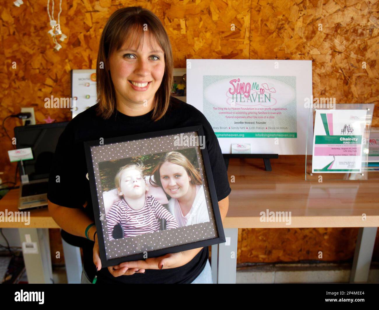This Aug. 2011 photo shows Jennifer Mehlert holding a photograph of her ...