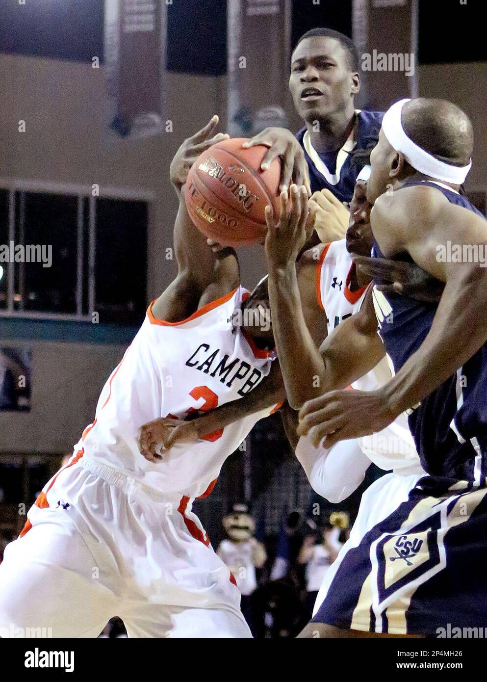 Charleston Southern's Malcolm Bernard (2) snatches the ball from Campbell's  D.J. Mason (35) during an NCAA college basketball game in the Big South  men's tournament, Wednesday, March 5, 2014, in Conway, S.C. (