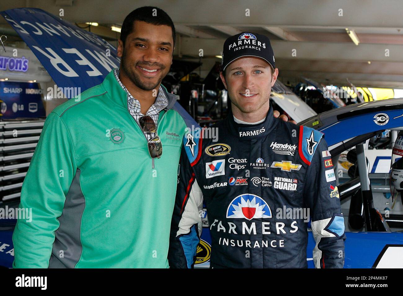 https://c8.alamy.com/comp/2P4MK87/seattle-seahawks-quarterback-russell-wilson-and-kasey-kahne-during-practice-for-the-nascar-sprint-cup-series-the-profit-on-cnbc-500-race-at-phoenix-international-raceway-saturday-march-1-2014-in-avondale-ariz-ap-photonkp-russell-labounty-mandatory-credit-2P4MK87.jpg