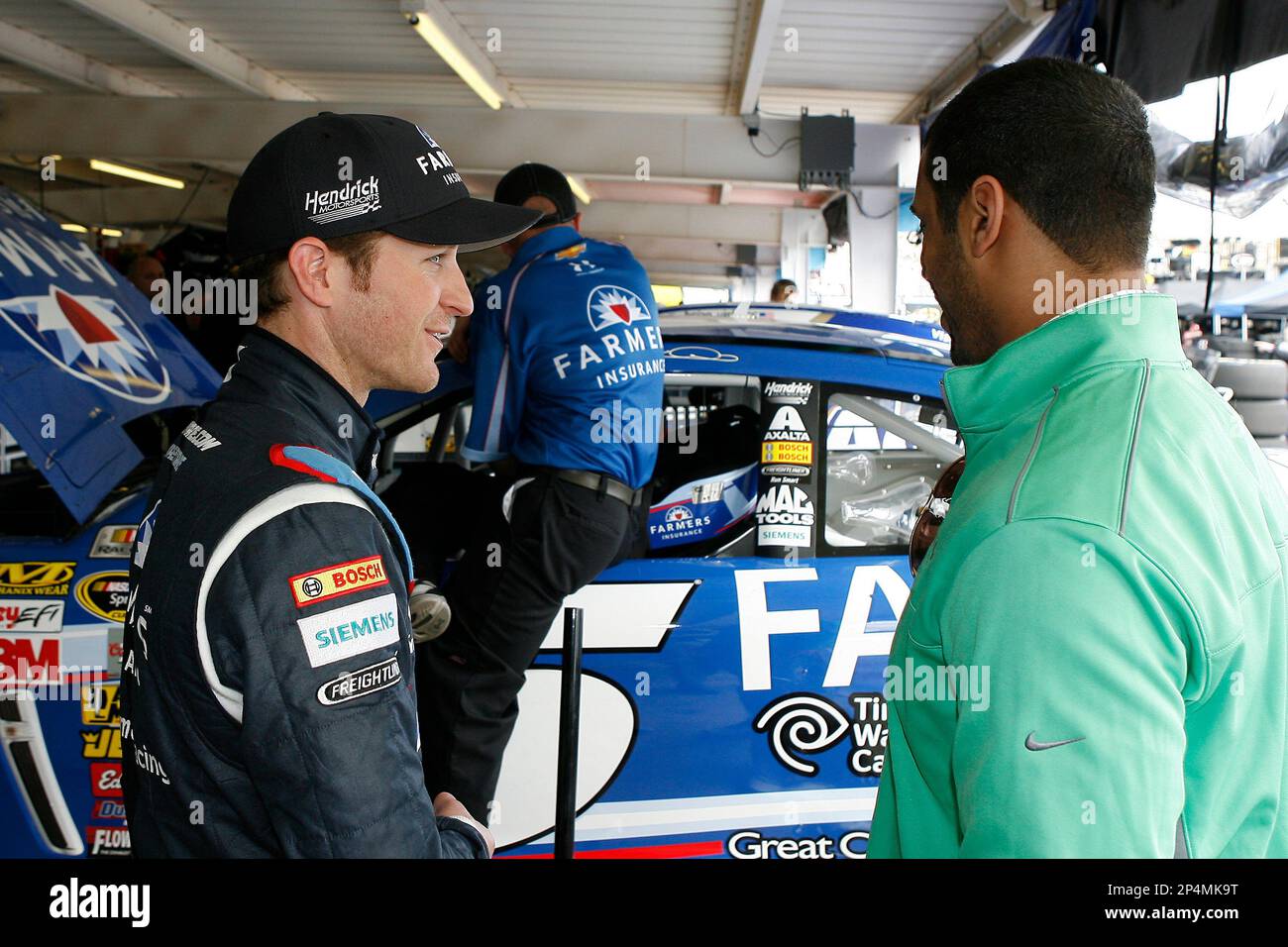 https://c8.alamy.com/comp/2P4MK9T/seattle-seahawks-quarterback-russell-wilson-and-kasey-kahne-during-practice-for-the-nascar-sprint-cup-series-the-profit-on-cnbc-500-race-at-phoenix-international-raceway-saturday-march-1-2014-in-avondale-ariz-ap-photonkp-russell-labounty-mandatory-credit-2P4MK9T.jpg