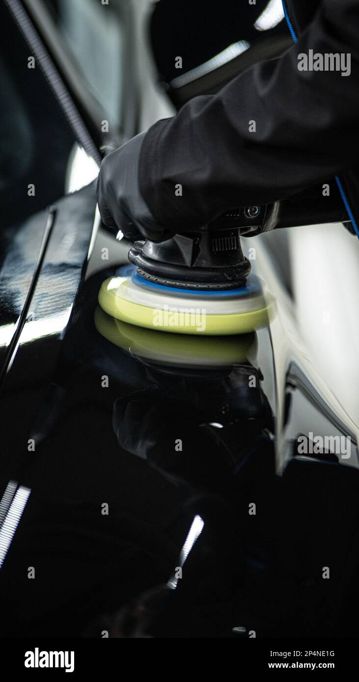 Car paint polishing in a car detailing studio Stock Photo Alamy