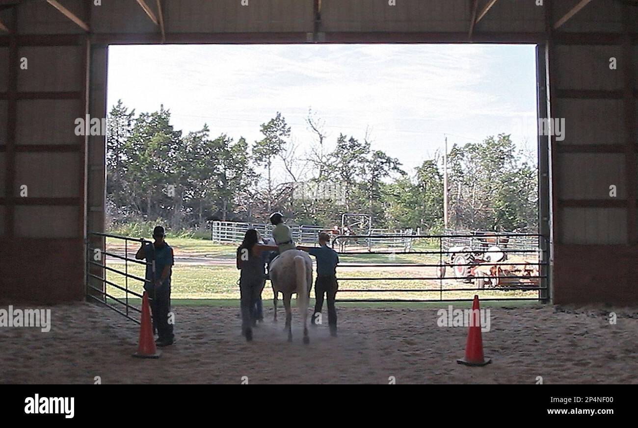 This photo taken Sept. 5, 2013, shows therapeutic horsemanship