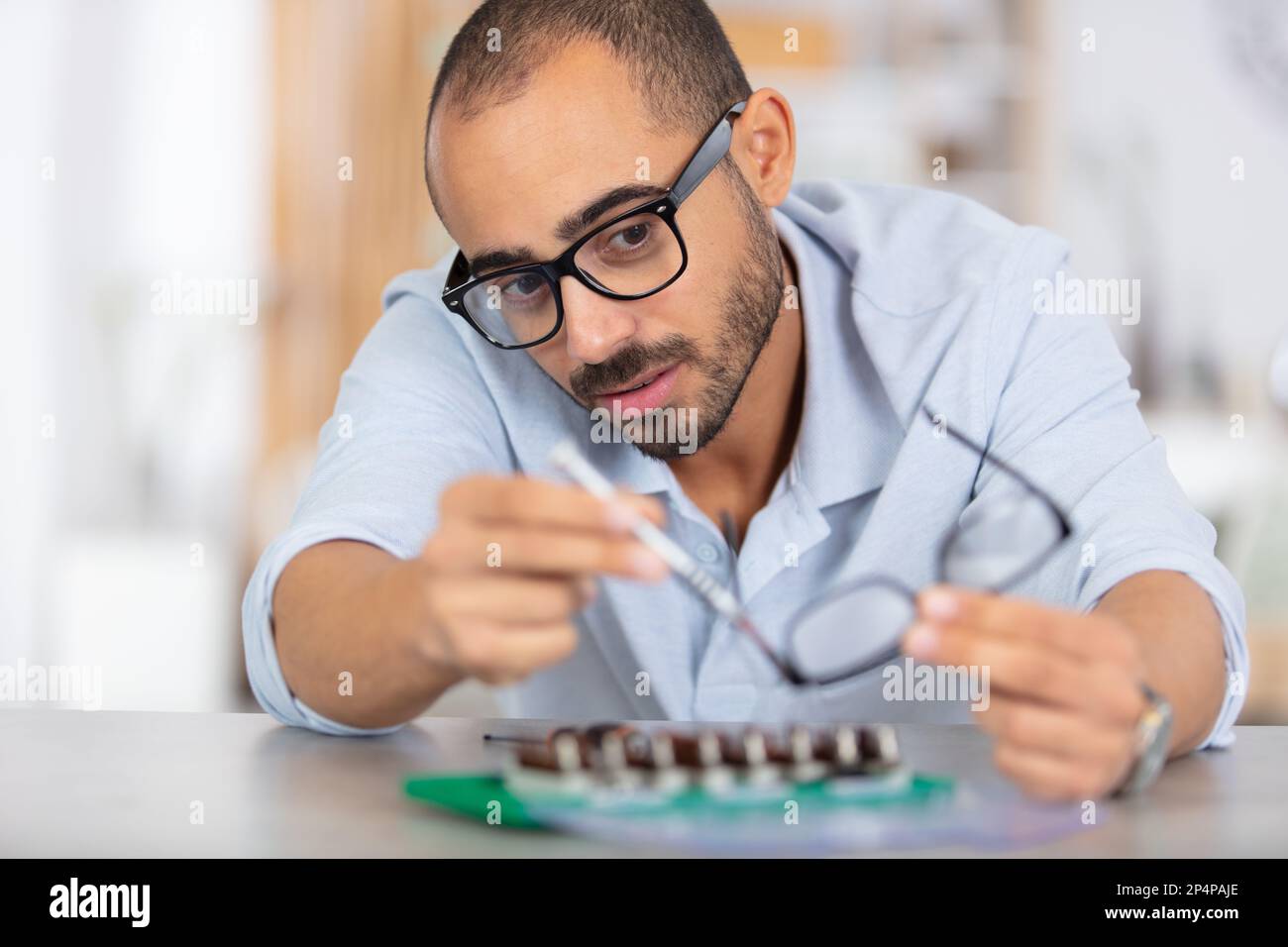 repairman working in technical support fixing computer laptop tr Stock Photo