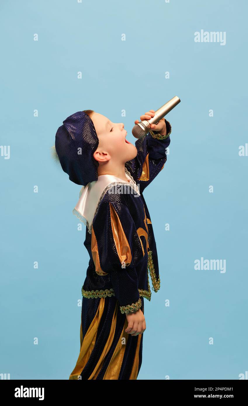 Happy preschool age boy in costume of medieval pageboy, little prince