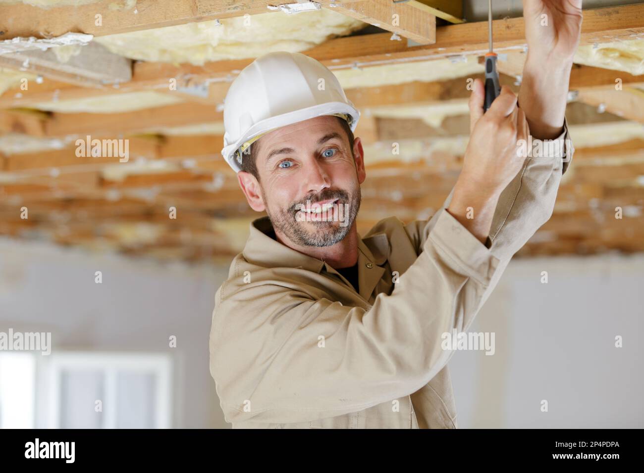 portrait of a happy builder at work Stock Photo