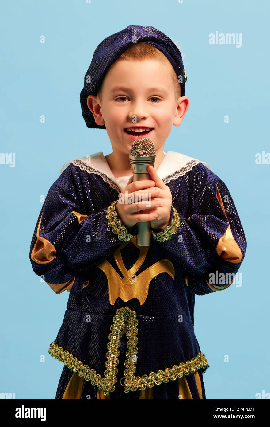 Happy preschool age boy in costume of medieval pageboy, little prince