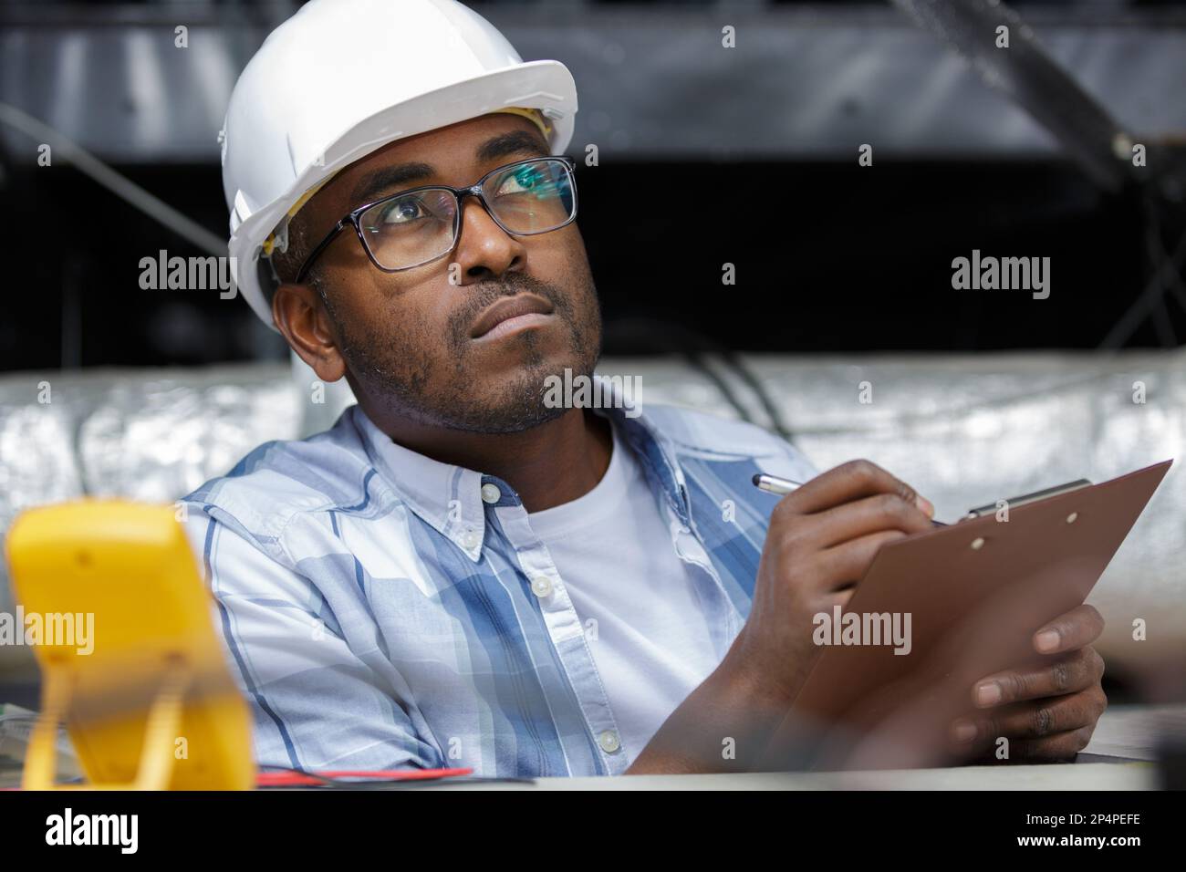electrician installing the ceiling light Stock Photo - Alamy