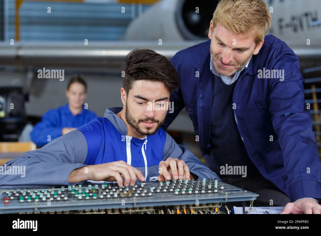 flight engineer seating at engine control panel Stock Photo Alamy