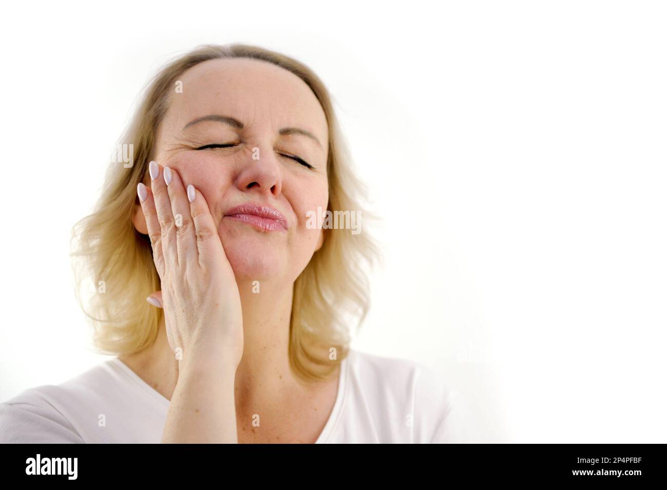 toothache cute middleaged woman holding cheek squinting eyes squeezing