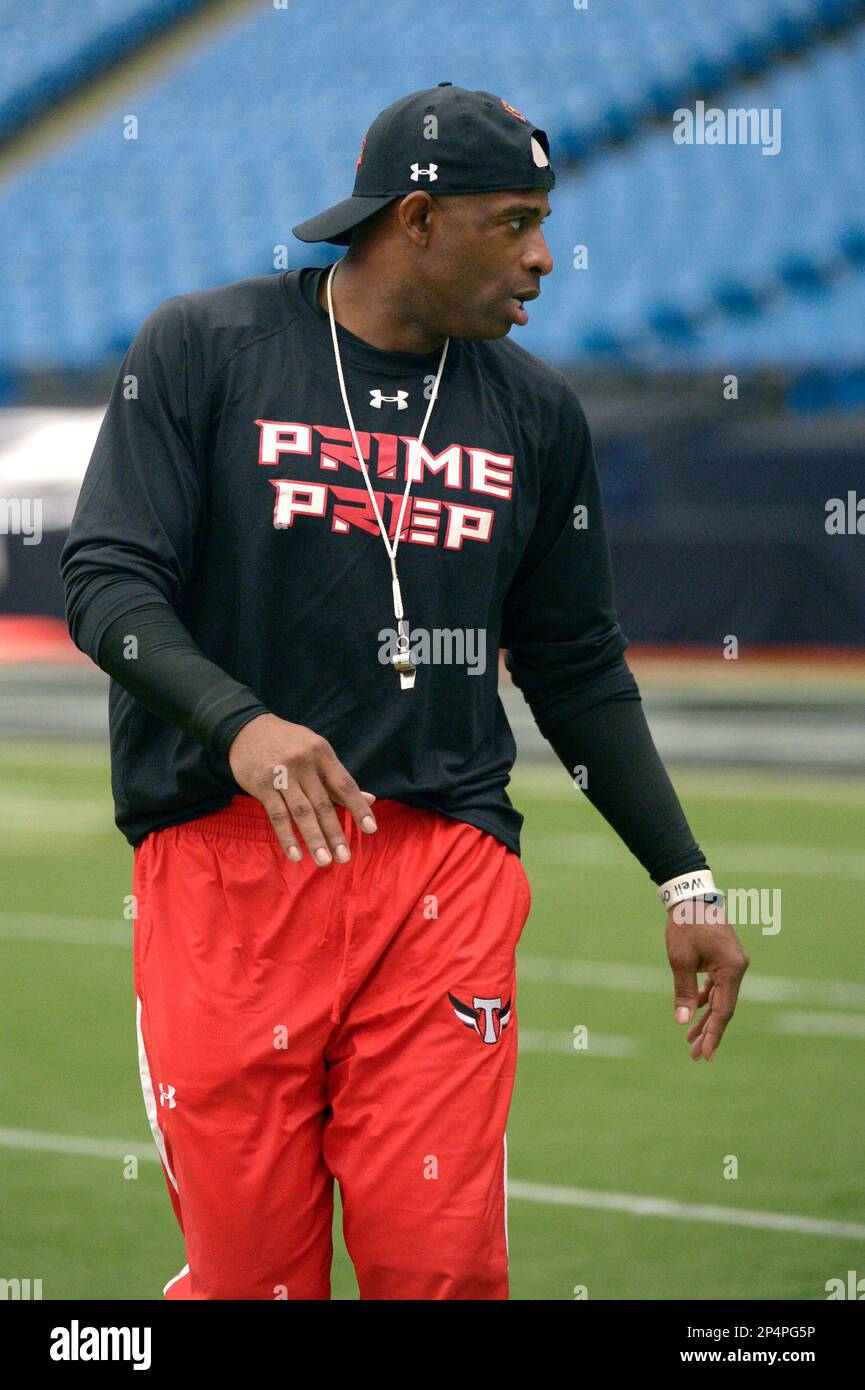 Former NFL defensive back Deion Sanders, left, talks with receiver George  Campbell (102), of Palm Harbor, Fla., during the underclassmen combine  before the Under Armour All-America football game in St. Petersburg, Fla.,