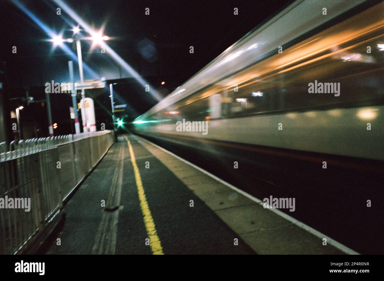 A train speeding through Hendon station Stock Photo