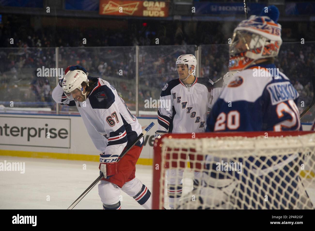 Jan. 29, 2014 - Bronx, New York, U.S - January 29, 2014: New York Rangers  left wing Benoit Pouliot (67) is excited in front of New York Islanders  goalie Evgeni Nabokov (20)