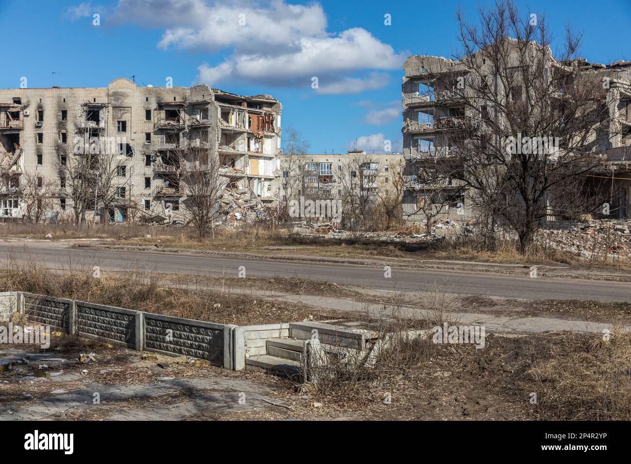 View of destroyed houses as a result of missile and artillery shelling by the Russian fascist army. Six months after the retreat of the Russian army, life in Izyum is gradually getting better, with electricity and water available, but the townspeople still suffer from the cold: broken boilers do not work and locals warm themselves with huts. The city is no longer under fire, but the risk of an explosion is still high: mines, tripwires, or unexploded shells are still everywhere. Izyum was liberated on 10 September 2022 during an Armed forces of Ukraine counter-offensive in the Kharkiv region. T Stock Photo