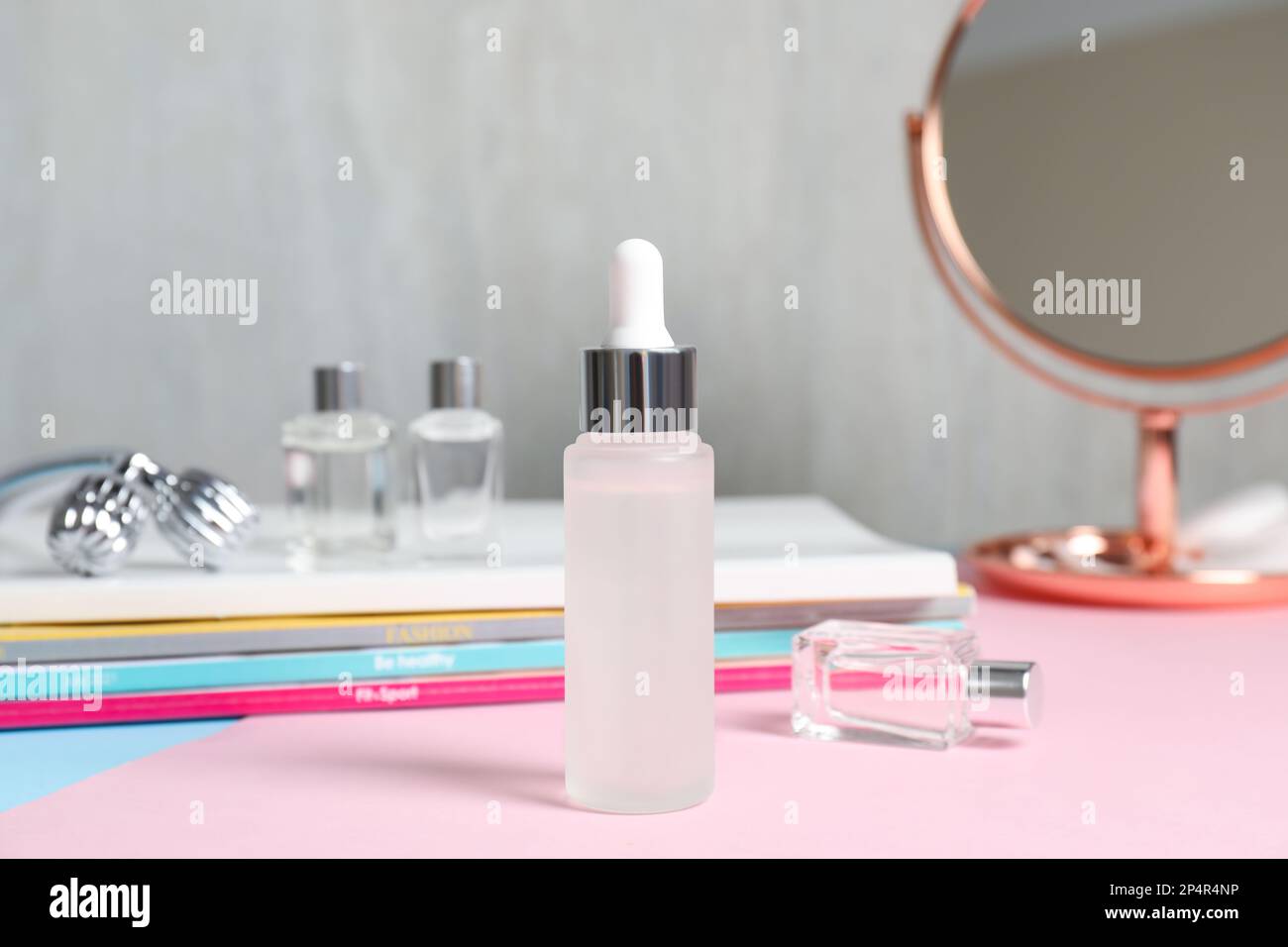 Bottle of cosmetic product on dressing table Stock Photo