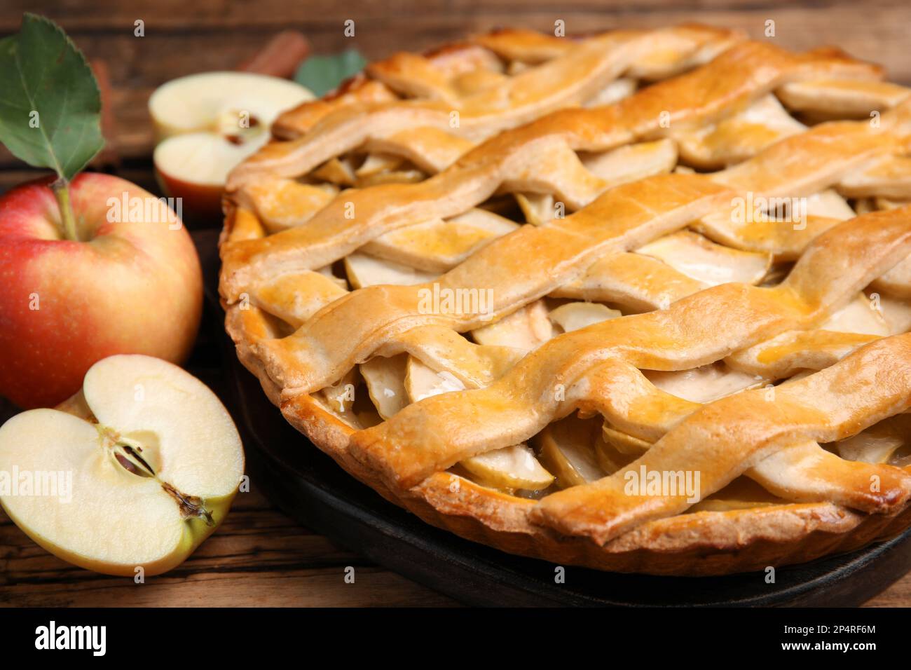 Delicious traditional apple pie on wooden table, closeup Stock Photo